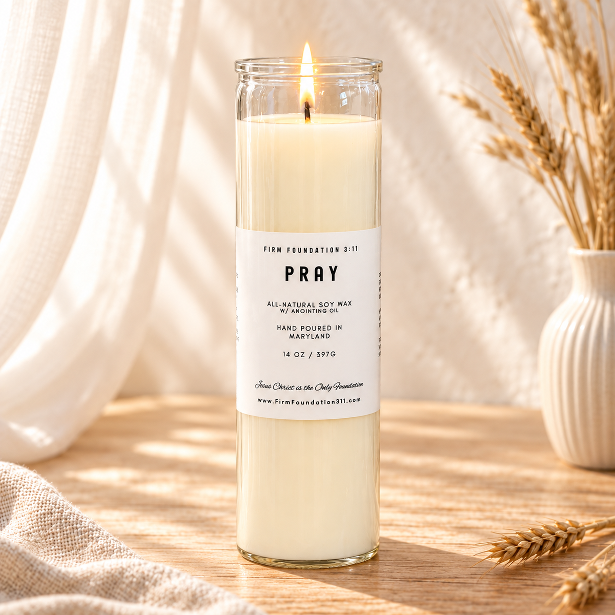 Pray prayer candle in a warm, sunlit setting