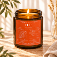 Rise prayer candle in a warm, sunlit setting